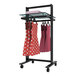 A black Udizine retail clothing display rack with two dresses on it.