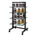 A black Udizine mobile retail clothing display stand with shelves holding bottles of protein.