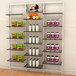 A white Udizine retail clothing display with shelves holding various clothing items.