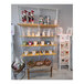 Udizine white wall-mount retail clothing display shelves with various items on them.