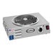 A silver Cadco portable electric hot plate with a round tubular element.