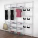 A white Udizine retail clothing display rack with shelves, clothes, and accessories on it.