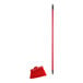 A red broom with a metal handle.