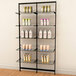 A black Udizine wall-mount clothing display with shelves holding different bottles of shampoo and lotion.