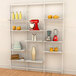 A white Udizine wall-mounted retail clothing display with shelves holding various items.