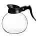 A Curtis glass coffee decanter with a black handle.