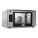 A silver and black Cadco Bakerlux countertop convection oven with a glass door.