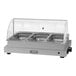A Cadco stainless steel countertop food warmer with three compartments and a roll top lid.