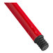 A red metal Lavex broom handle with black caps.