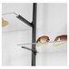 A black UDIZINE Vertik shelf bracket set holding a pair of sunglasses on a shelf.