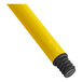 A yellow metal tube with black rubber tips.