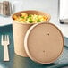 A Choice kraft paper food container with macaroni and cheese and a vented paper lid.