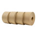 Three rolls of brown paper with white paper on the ends.