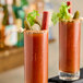 Two glasses of Zing Zang Bloody Mary on a table in a brunch café.