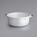 A white pot with a handle.