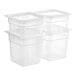 A stack of clear plastic Cambro FreshPro containers with lids.