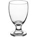 A clear glass goblet with a stem.