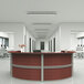 A cherry laminate 4 panel curved u-shape reception desk.