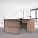 A walnut laminate curved U-shape reception counter with a wooden top.
