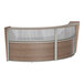 A Correll walnut laminate curved reception desk with glass panels.