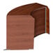 A wooden curved reception desk with a cherry wood curved top.