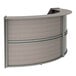 A Correll Ash laminate 2 panel curved reception desk with a curved top.