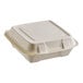 A Dart white molded fiber takeout container with a hinged lid.