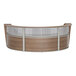 A Correll walnut laminate curved reception desk with a glass top.