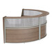 A walnut laminate curved reception desk with a glass panel.