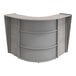 A Correll curved reception desk with an ash finish.