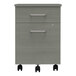 A grey Correll mobile pedestal filing cabinet with black wheels.
