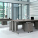 A large office with a desk and computer with a Correll steel mobile pedestal filing cabinet.