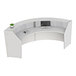 A white Correll curved reception desk with a computer and keyboard.