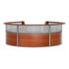 A cherry wood curved reception desk with a see-through top panel.