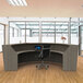 A modern curved Correll reception desk in an office.