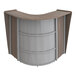 A Correll curved reception desk with a walnut laminate curved top.