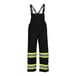 A pair of black Tingley overalls with yellow reflective stripes.