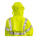 A person wearing a Tingley Hi-Vis yellow jacket with reflective stripes.