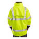 A person wearing a Tingley yellow and black industrial work jacket.