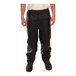 A man wearing Tingley black rain pants.