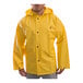 A person wearing a yellow Tingley DuraScrim industrial work jacket.