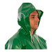 A man wearing a Tingley green SafetyFlex coverall with hood.