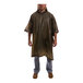 A man wearing an olive drab Tingley rain poncho.