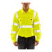 A man wearing a Tingley hi-vis lime yellow long sleeve safety shirt.