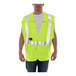 A man wearing a Tingley yellow flame-resistant safety vest.