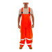 Tingley Eclipse Class E Hi-Vis Orange Overalls with reflective stripes on a man.