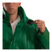 A man wearing a Tingley green SafetyFlex jacket with a square window button.