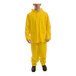 A man wearing a Tingley yellow rainsuit