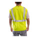 A man wearing a Tingley hi-vis lime safety vest.