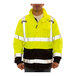 A man wearing a Tingley hi-vis yellow and black jacket.
